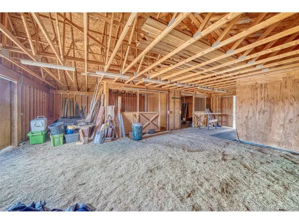 a view of a room with wooden walls and stairs