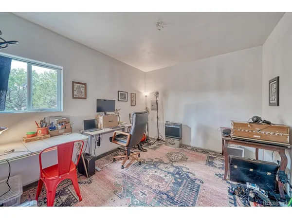 a view of a room with wooden stairs