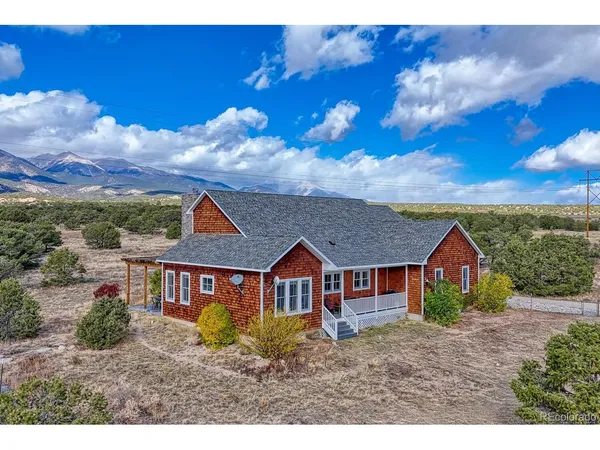 a view of house with wooden fence