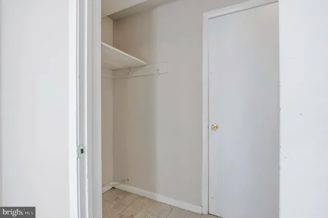 a view of bathroom with a sink and mirror