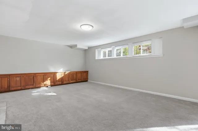 a view of wooden floor in an empty room