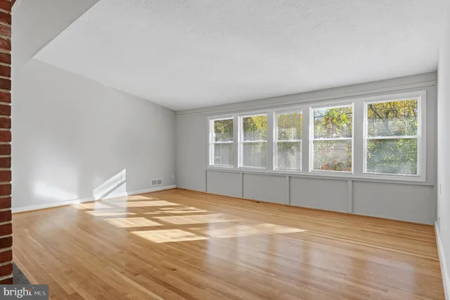 a kitchen with granite countertop a sink a counter space appliances and cabinets