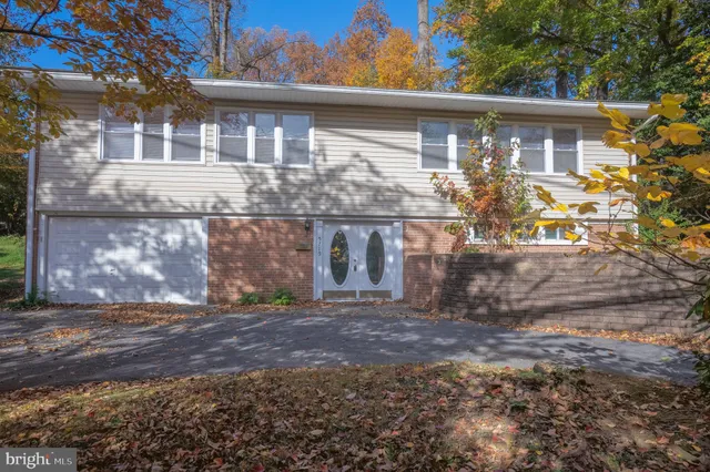 a front view of house with a garden