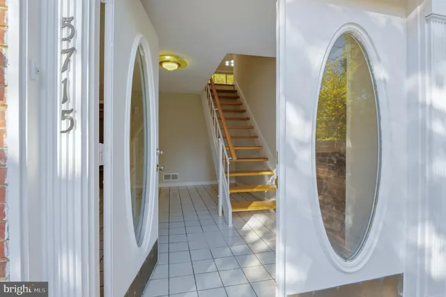 a view of an empty room and closet area