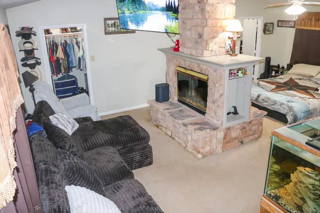 a living room with furniture and a fireplace