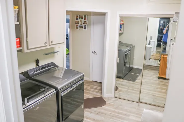 a kitchen with a sink and a refrigerator