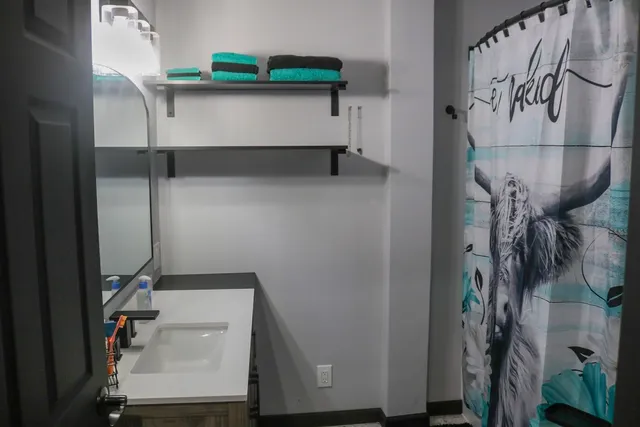 a bathroom with a bathtub and shower