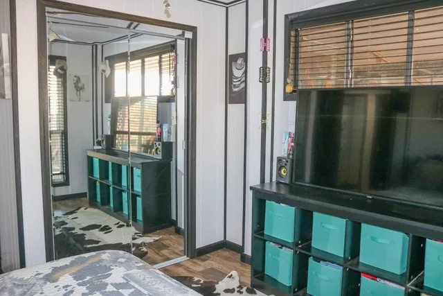 a bedroom with a bed and a window