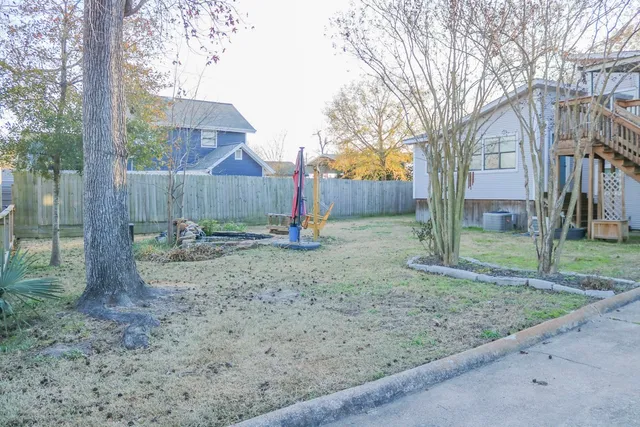 a view of a yard with a tree