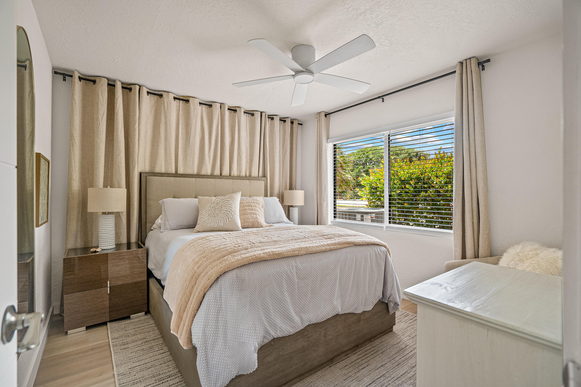 2330 North Ocean Boulevard Boca Raton, FL 33431 - Photo 12 of 31 a bedroom with a bed and a large window