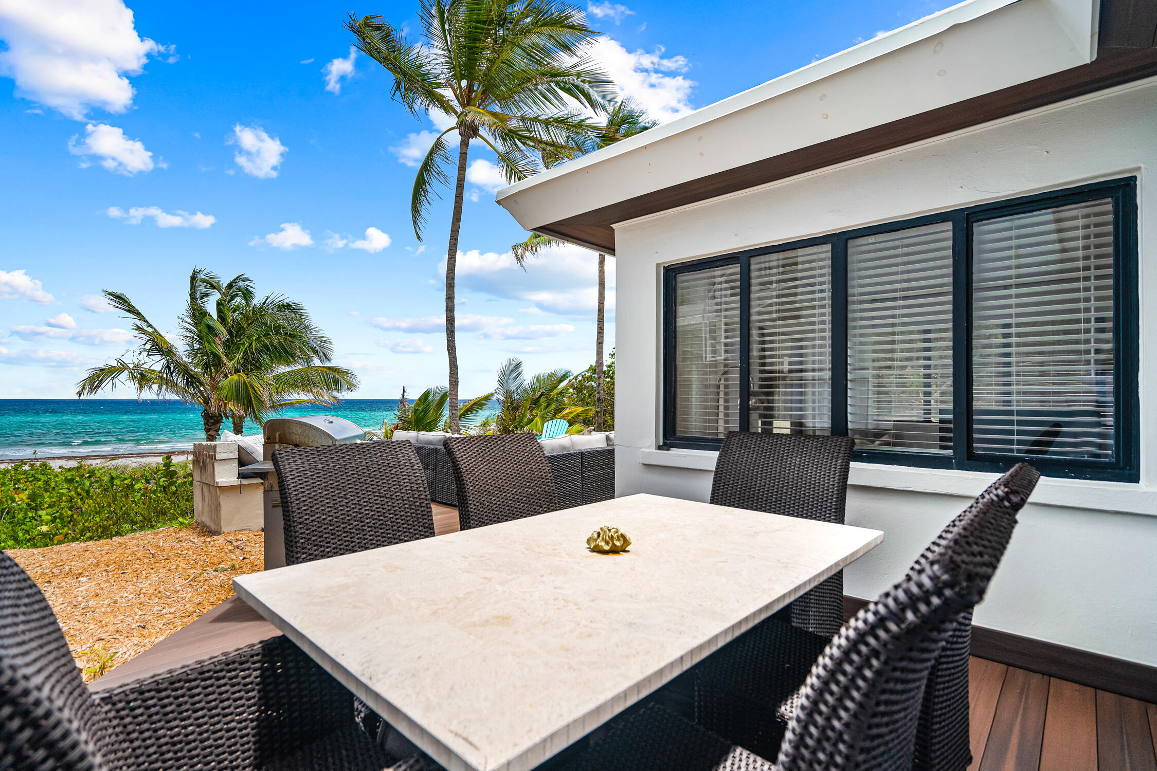 2330 North Ocean Boulevard Boca Raton, FL 33431 - Photo 13 of 31 a view of an outside dining space with furniture