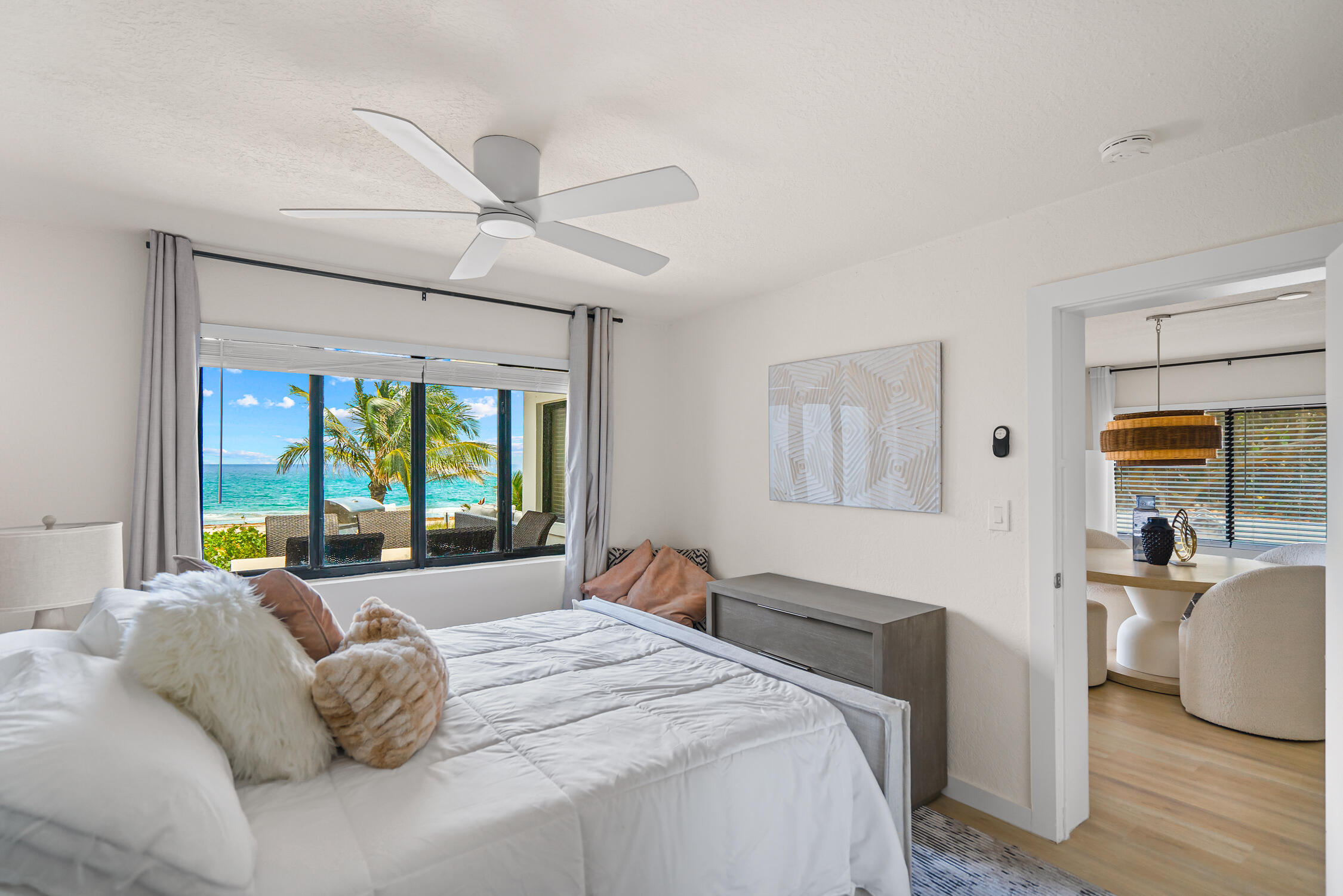 2330 North Ocean Boulevard Boca Raton, FL 33431 - Photo 14 of 31 a bedroom with a large bed and a large window