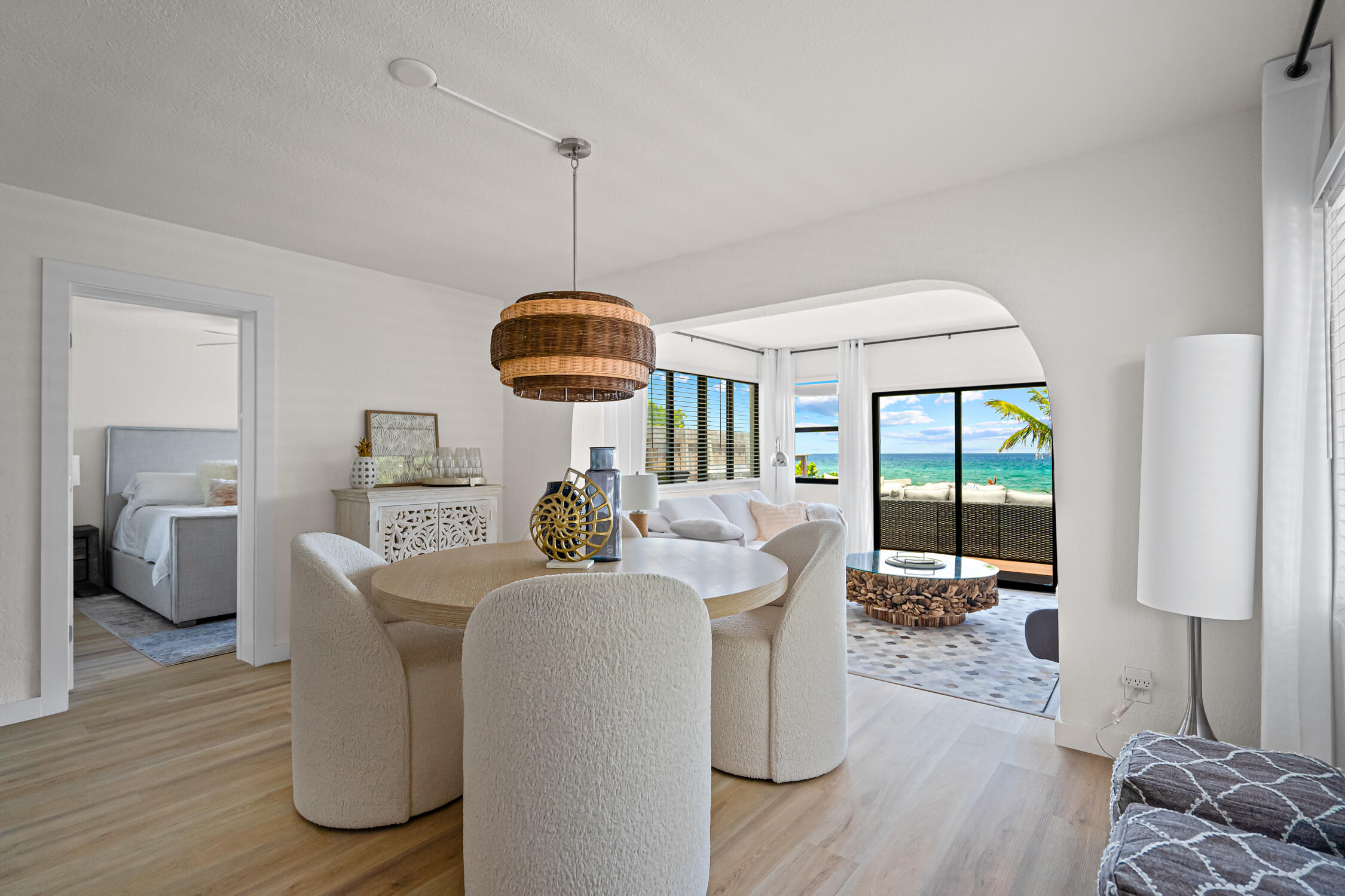 2330 North Ocean Boulevard Boca Raton, FL 33431 - Photo 15 of 31 a living room with furniture a window and a chandelier
