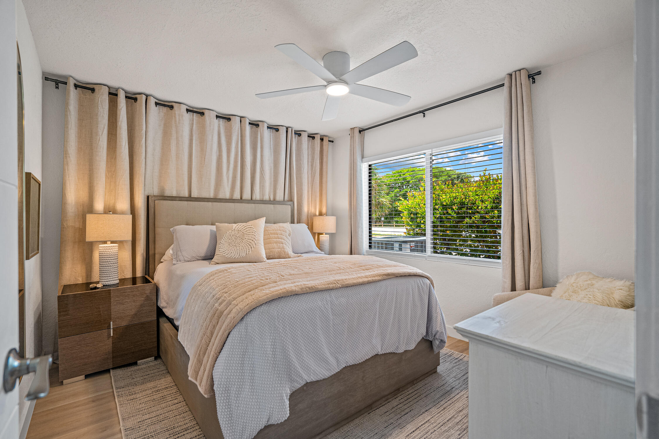 2330 North Ocean Boulevard Boca Raton, FL 33431 - Photo 16 of 31 a bedroom with a large bed and a large window