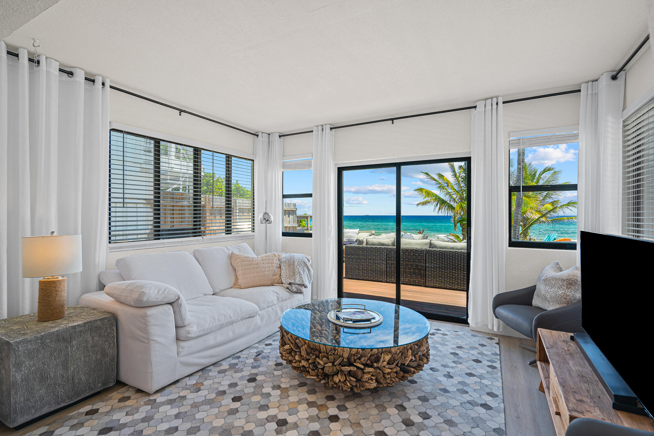 2330 North Ocean Boulevard Boca Raton, FL 33431 - Photo 20 of 31 a living room with furniture and a large window