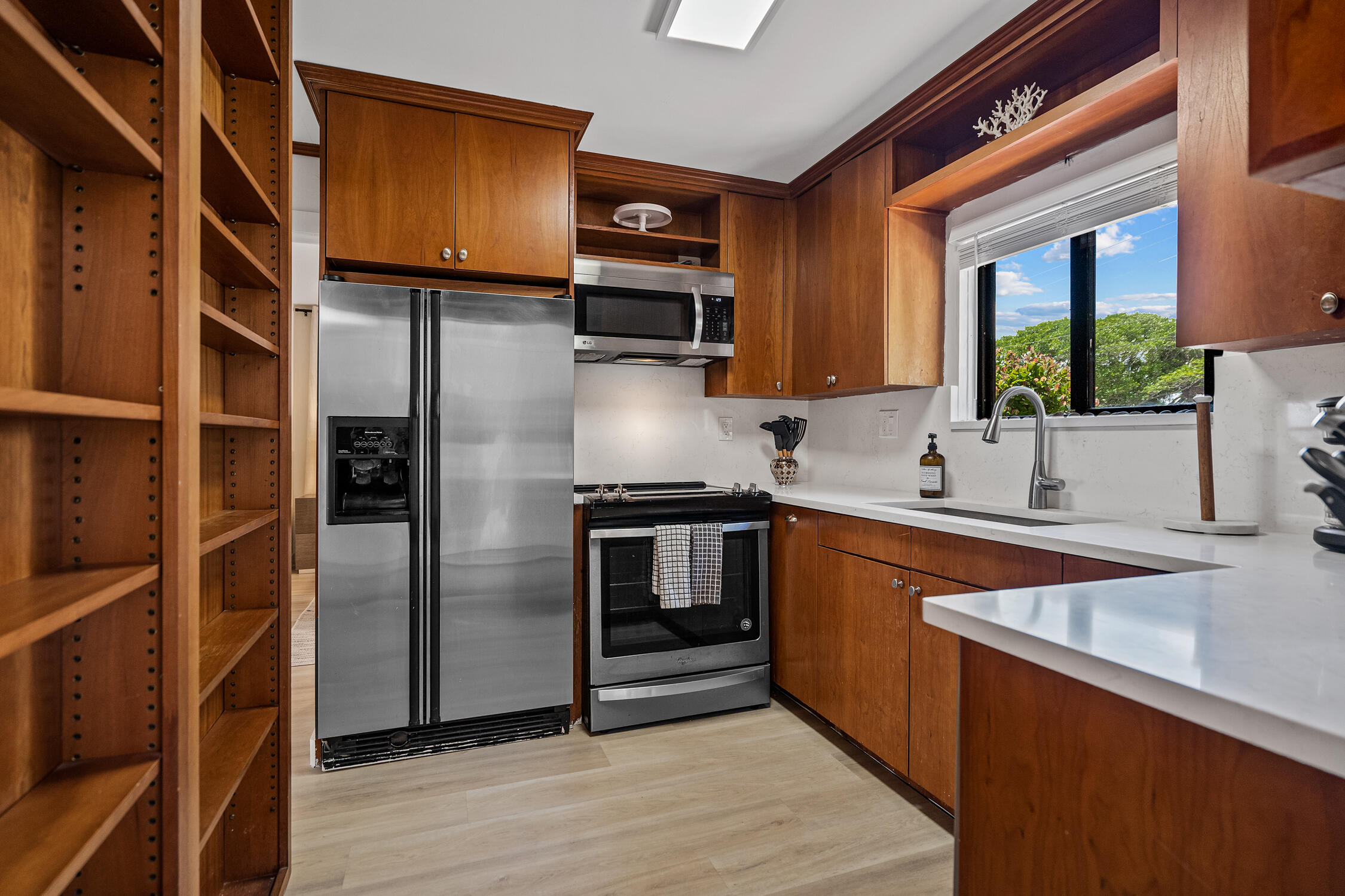 2330 North Ocean Boulevard Boca Raton, FL 33431 - Photo 24 of 31 a kitchen with stainless steel appliances granite countertop a refrigerator and a sink