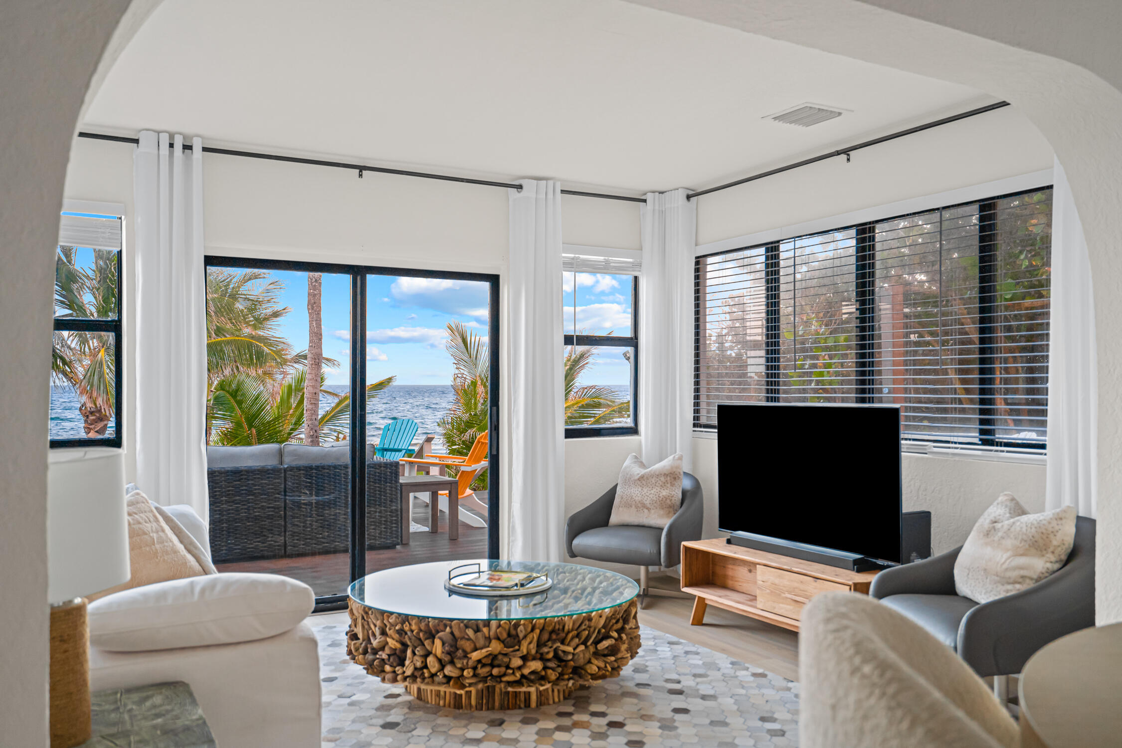 2330 North Ocean Boulevard Boca Raton, FL 33431 - Photo 27 of 31 a living room with furniture and a flat screen tv