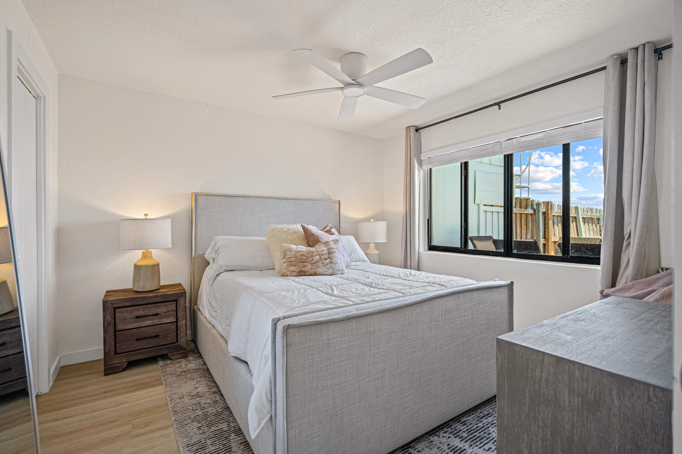 2330 North Ocean Boulevard Boca Raton, FL 33431 - Photo 29 of 31 a bedroom with a large bed and a large window