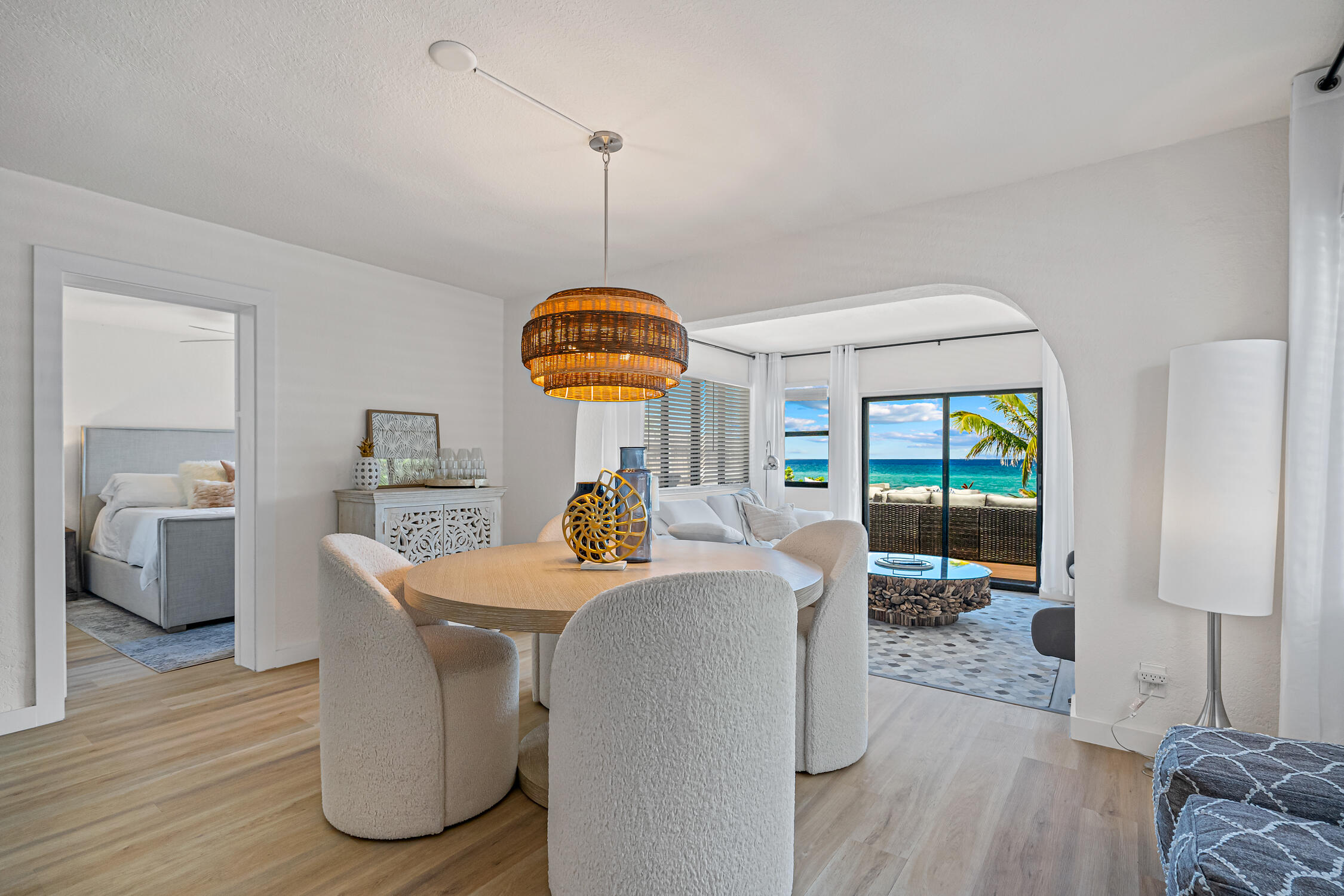 2330 North Ocean Boulevard Boca Raton, FL 33431 - Photo 30 of 31 a view of a dining room with furniture wooden floor and a chandelier