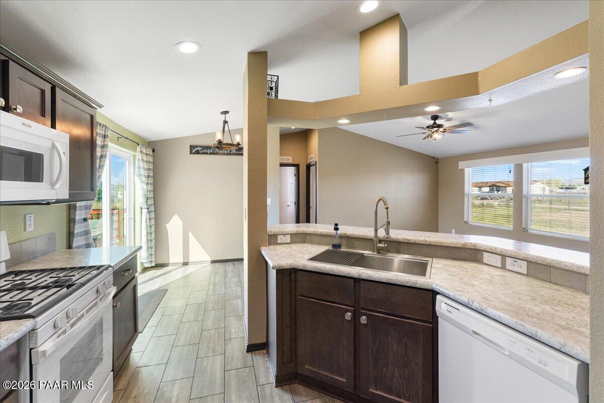 325 East Houston Road Paulden, AZ 86334 - Photo 15 of 40 a kitchen with a sink stove and cabinets