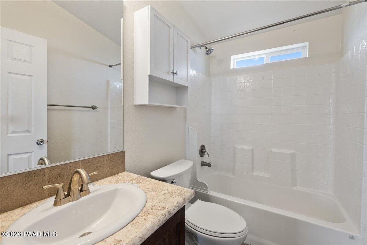 325 East Houston Road Paulden, AZ 86334 - Photo 19 of 40 a bathroom with a granite countertop sink toilet and shower
