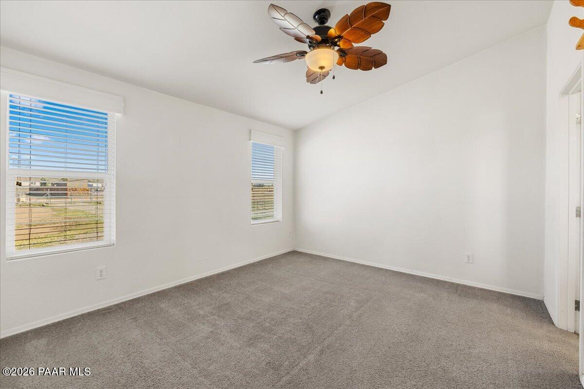 325 East Houston Road Paulden, AZ 86334 - Photo 21 of 40 an empty room with a window and a fan