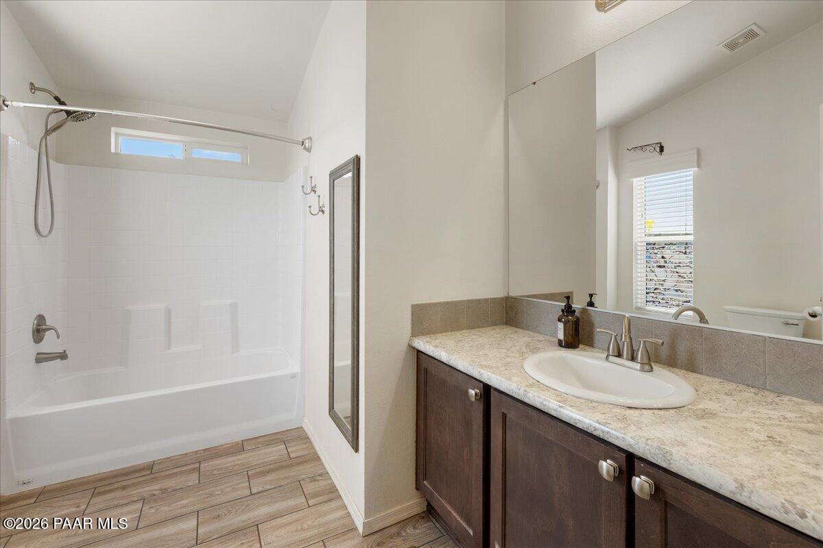 325 East Houston Road Paulden, AZ 86334 - Photo 23 of 40 a bathroom with a granite countertop sink and a mirror