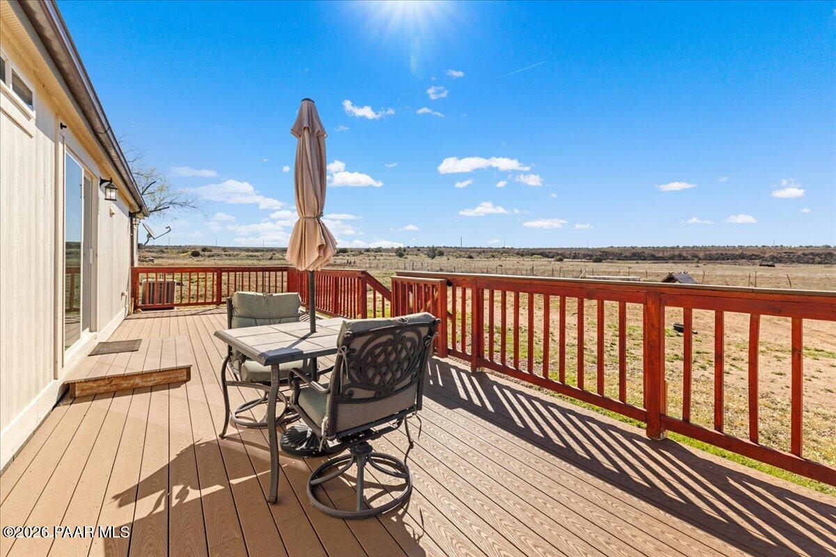325 East Houston Road Paulden, AZ 86334 - Photo 27 of 40 a view of a balcony with furniture and wooden floor