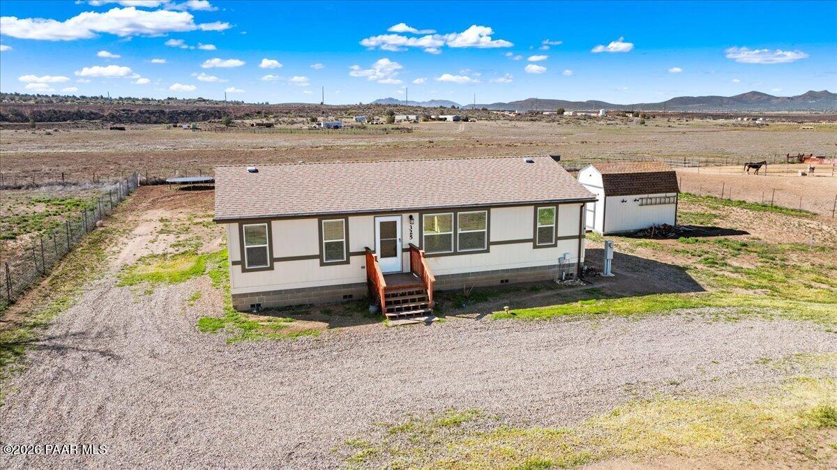 325 East Houston Road Paulden, AZ 86334 - Photo 33 of 40 a aerial view of a house with swimming pool and a yard
