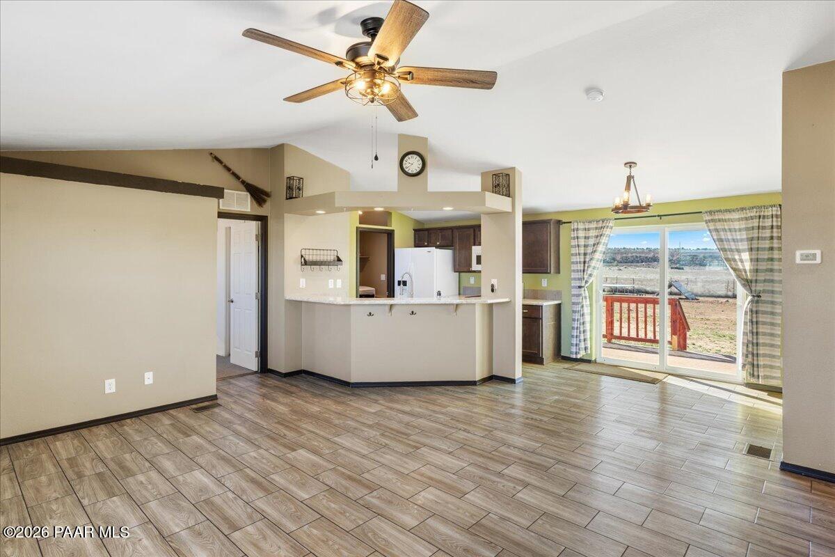 325 East Houston Road Paulden, AZ 86334 - Photo 5 of 40 a view of a big room with wooden floor and windows