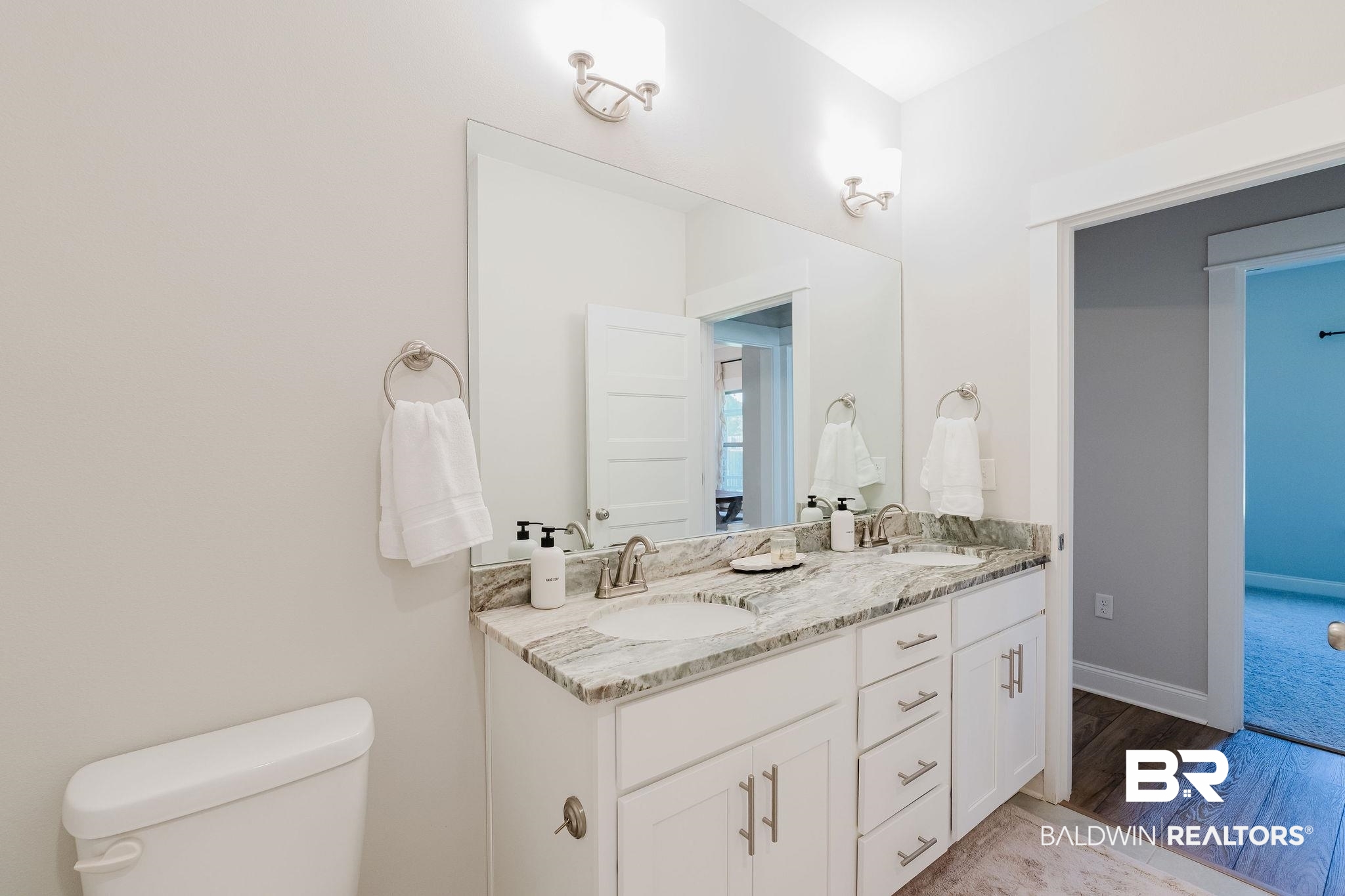 7872 Calverton Street Foley, AL 36535 - Photo 47 of 76 Double vanity featuring white cabinetry, brushed nickel hardware, and a stone countertop