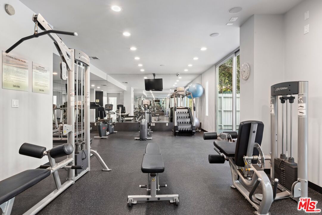 1100 Alta Loma Road, Unit 902 West Hollywood, CA 90069 - Photo 13 of 17 a view of a room with gym equipment