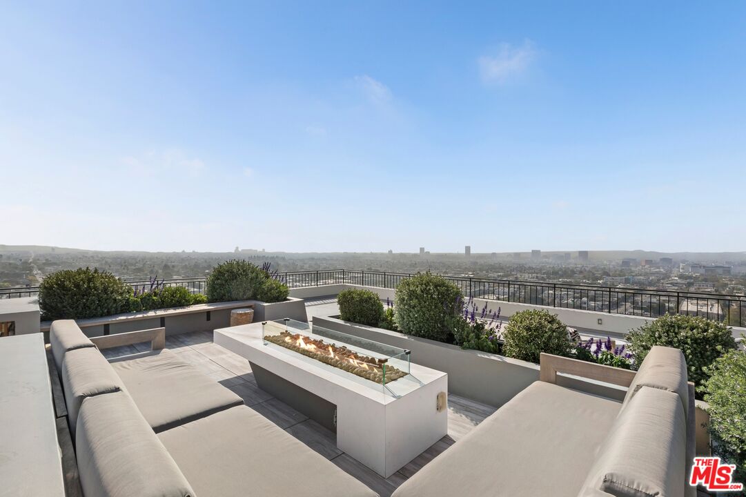 1100 Alta Loma Road, Unit 902 West Hollywood, CA 90069 - Photo 16 of 17 a view of a city from a terrace