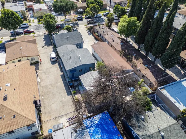 an aerial view of a residential houses with street