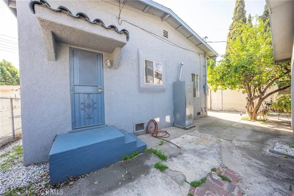 a view of dinning table and chairs in patio