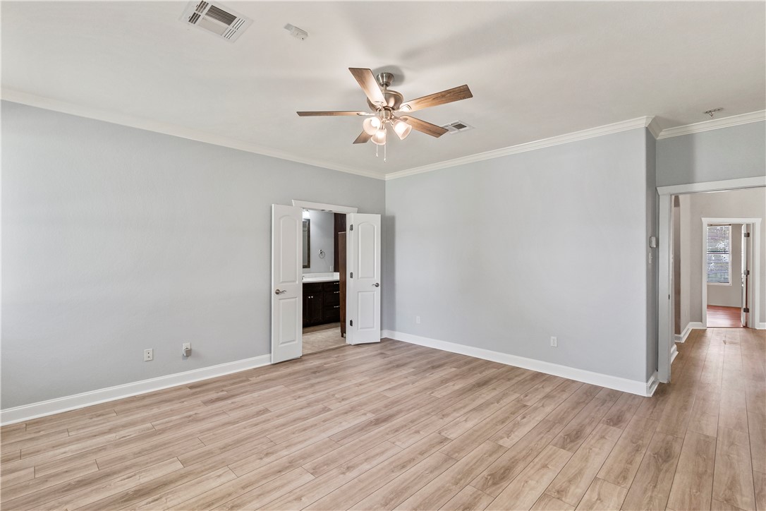 6701 Old Reliance Road Bryan, TX 77808 - Photo 18 of 44 wooden floor in an empty room with a window