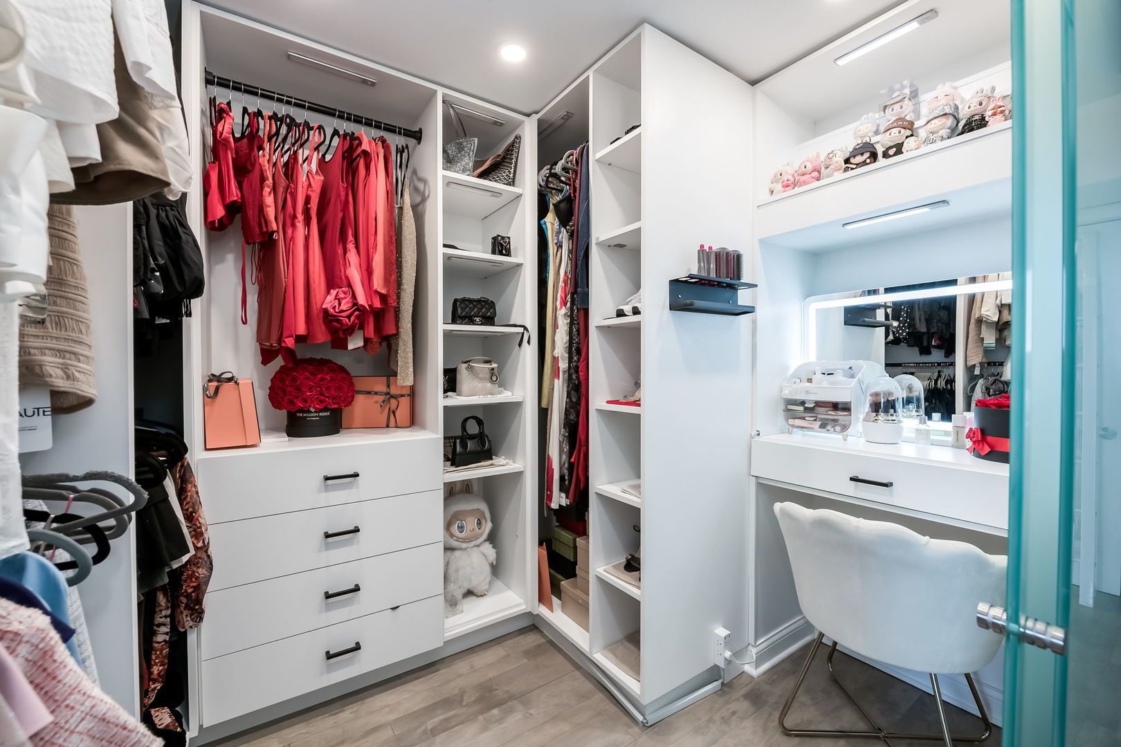 111 East Chestnut Street, Unit 37K Chicago, IL 60611 - Photo 16 of 37 a view of walk in closet with clothes and shoes