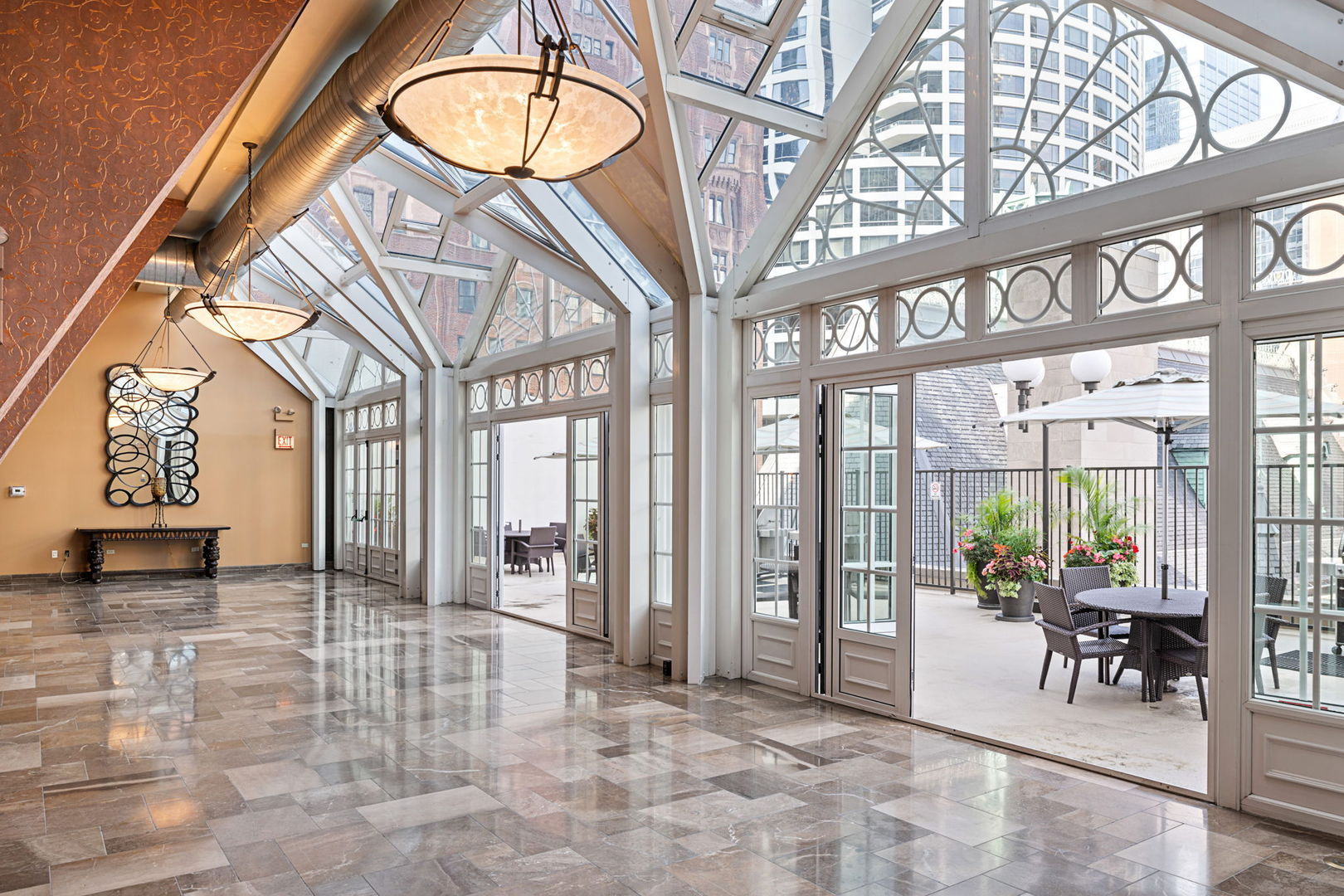 111 East Chestnut Street, Unit 37K Chicago, IL 60611 - Photo 28 of 37 a view of an entryway with a table and chairs