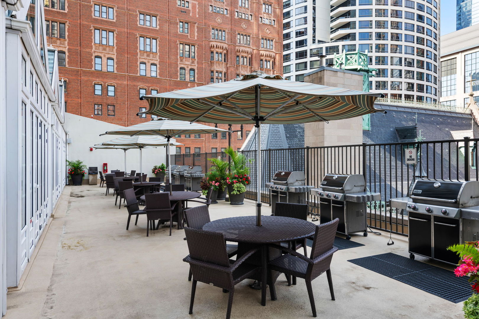 111 East Chestnut Street, Unit 37K Chicago, IL 60611 - Photo 31 of 37 a view of a dinning table and chairs in the patio