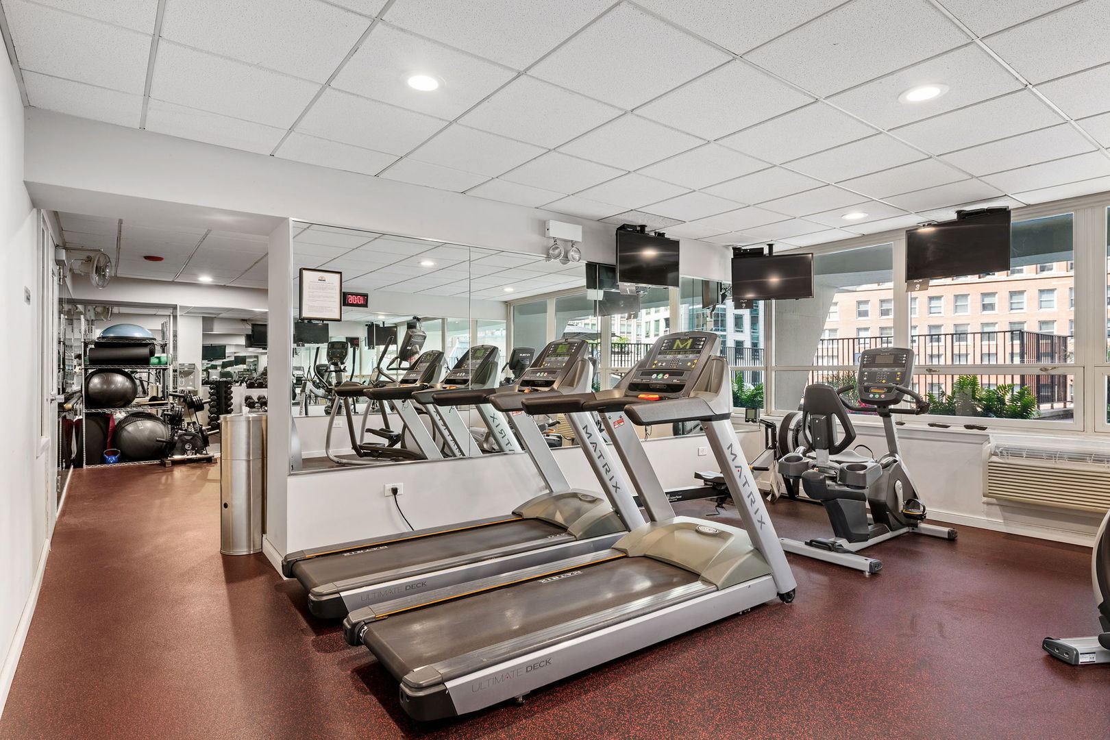 111 East Chestnut Street, Unit 37K Chicago, IL 60611 - Photo 32 of 37 a view of a room with gym equipment