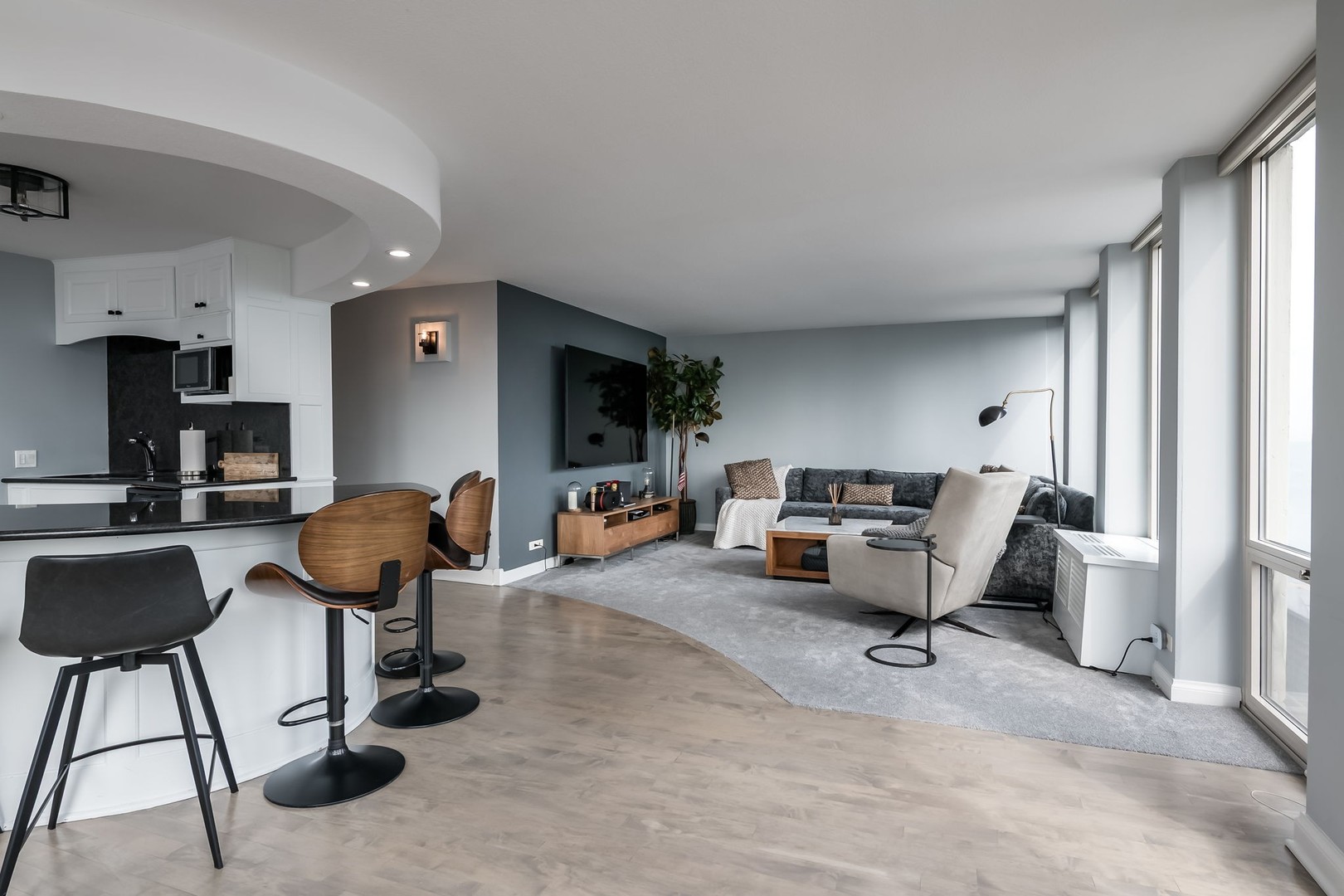 111 East Chestnut Street, Unit 37K Chicago, IL 60611 - Photo 8 of 37 a living room with furniture and a flat screen tv