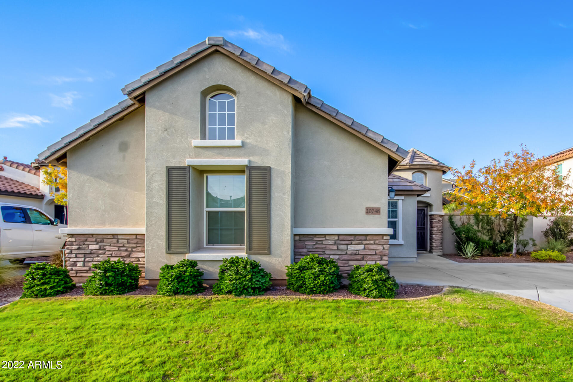 20748 West White Rock Road Buckeye, AZ 85396 - Photo 1 of 34 a front view of a house with a yard and garage