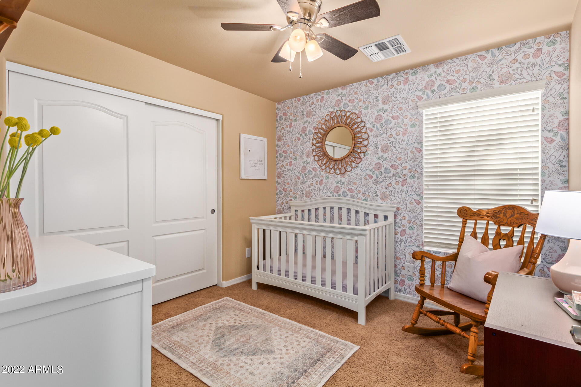 20748 West White Rock Road Buckeye, AZ 85396 - Photo 21 of 34 a bedroom with furniture and a window
