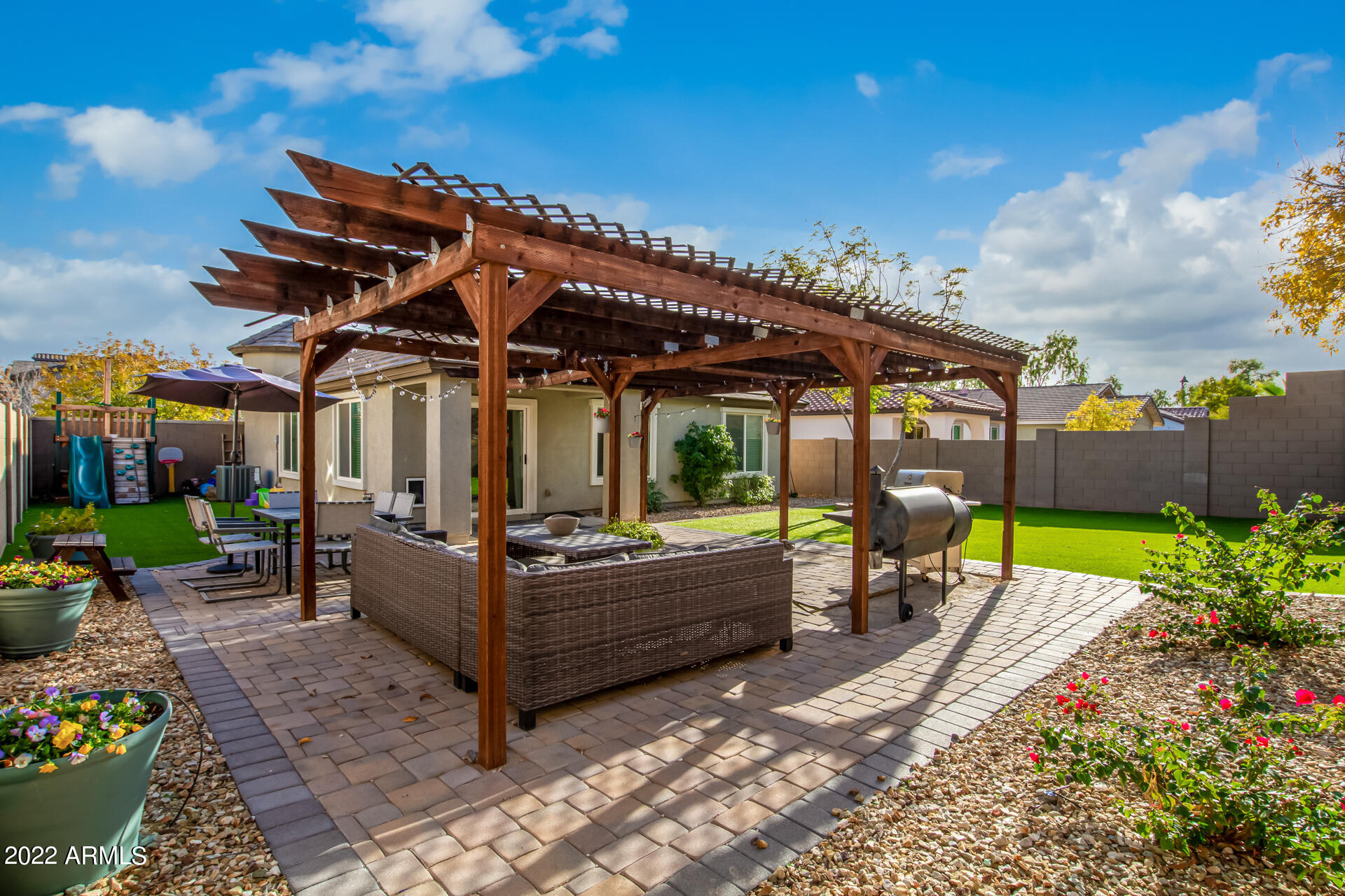 20748 West White Rock Road Buckeye, AZ 85396 - Photo 31 of 34 a view of a house with backyard sitting area and garden