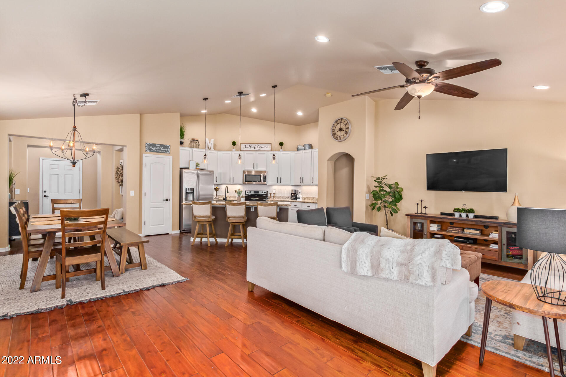 20748 West White Rock Road Buckeye, AZ 85396 - Photo 7 of 34 a living room with furniture and a flat screen tv