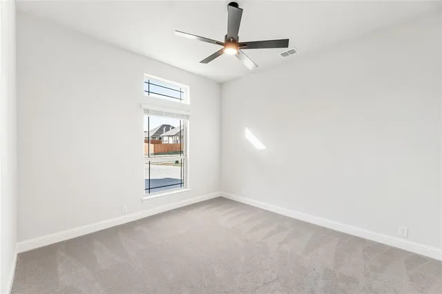 a view of room with white cabinets
