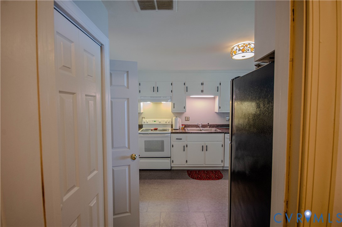12500 Musical Lane Midlothian, VA 23113 - Photo 36 of 51 Kitchen featuring white cabinetry, dark countertop