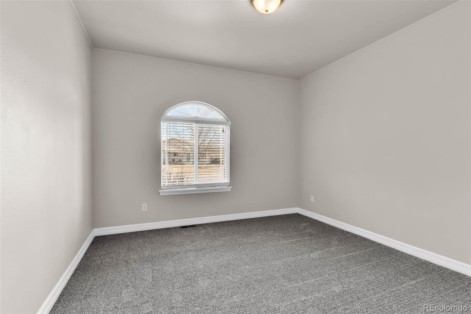 249 High Meadows Drive Florence, CO 81226 - Photo 14 of 47 an empty room with a window