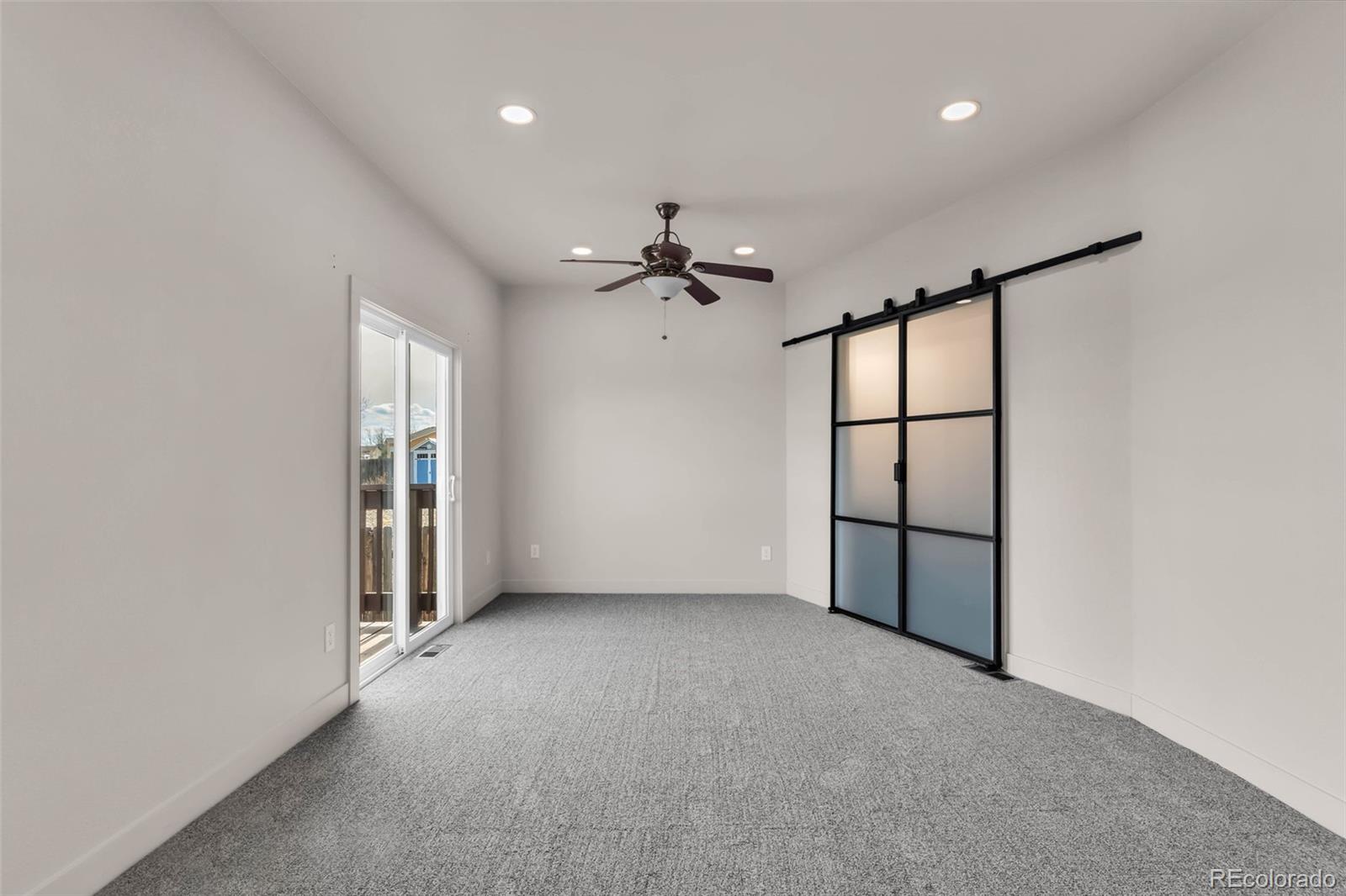 249 High Meadows Drive Florence, CO 81226 - Photo 17 of 47 wooden floor in an empty room with a window