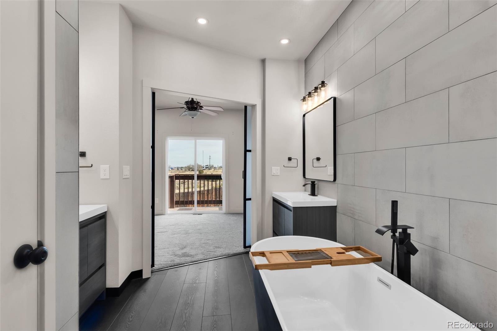 249 High Meadows Drive Florence, CO 81226 - Photo 23 of 47 a bedroom with a bed and wooden floor